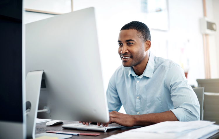 Man looking at computer in office