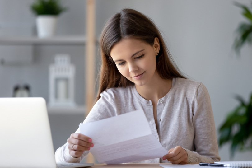Woman reviewing medical rebate at home