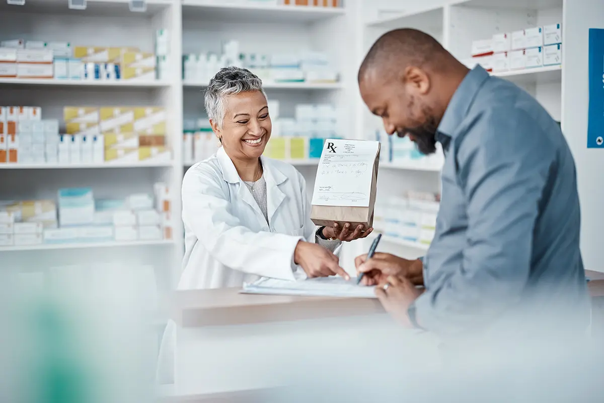 Pharmacist helping patient